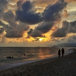 Scenic view of sea against cloudy sky