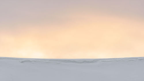 Scenic view of snow landscape against sky