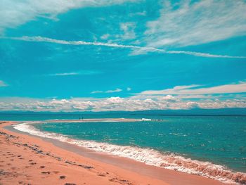 Scenic view of sea against blue sky