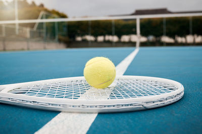 Close-up of tennis ball on court