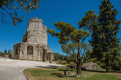 View of the tour magne at the gardens of the fountain in nimes, france.