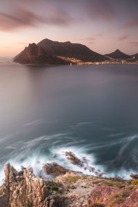 Scenic view of sea against cloudy sky