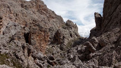 Low angle view of rocks against sky