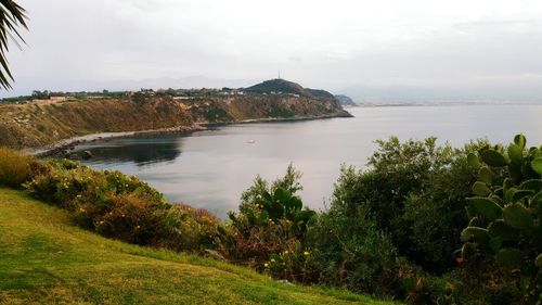 Scenic view of landscape against cloudy sky