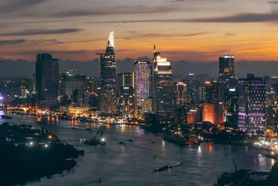 View of illuminated buildings against sky during sunset