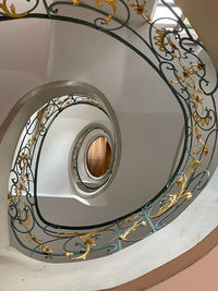 Low angle view of spiral staircase in building