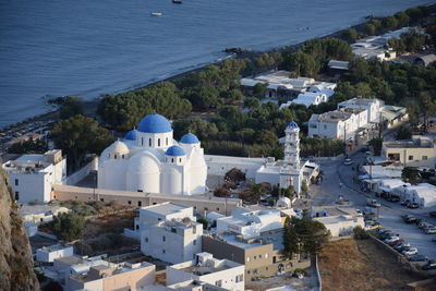 High angle view of buildings by sea