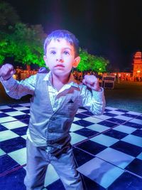 Full length of girl standing at night