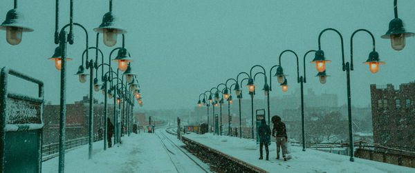 Panoramic shot of illuminated street lights in winter