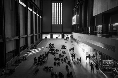 High angle view of people walking in building