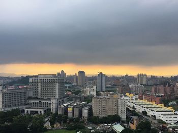 High angle view of buildings against sky during sunset