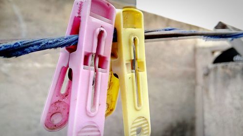 Close-up of multi colored clothespins on clothesline