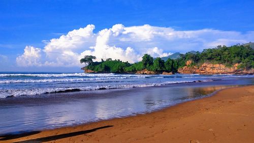 Scenic view of beach against sky