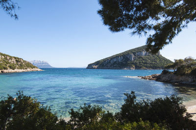 Scenic view of sea against clear blue sky