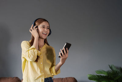 Young woman using mobile phone