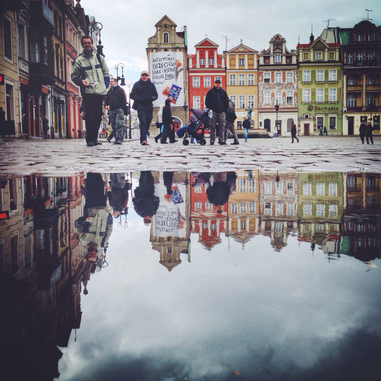 architecture, building exterior, built structure, water, reflection, men, person, lifestyles, waterfront, large group of people, sky, walking, city, leisure activity, medium group of people, city life, tourist, building, travel destinations