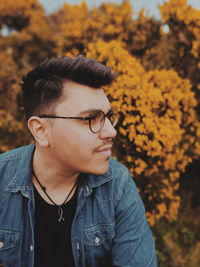 Close-up of young man looking away outdoors