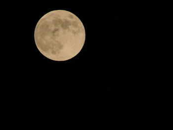 Low angle view of full moon in sky