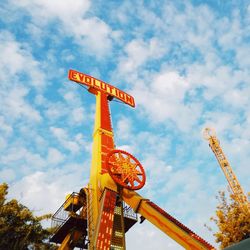 Low angle view of ferris wheel against sky