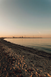 Scenic view of sea against clear sky during sunset