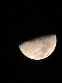 Low angle view of moon against clear sky at night