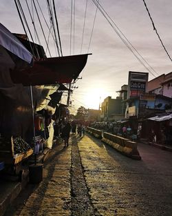 People on street at sunset