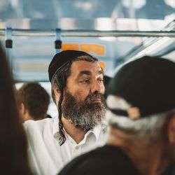 Portrait of man sitting in bus