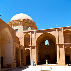 View of historical building against clear blue sky