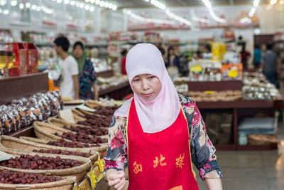 Full length of a man standing at market stall