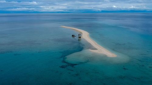 Scenic view of sea against blue sky