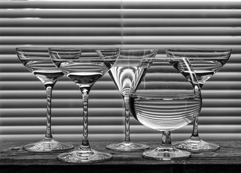 Close-up of wine glasses on table