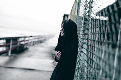 Woman standing against sky