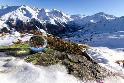 Scenic view of snowcapped mountains against sky