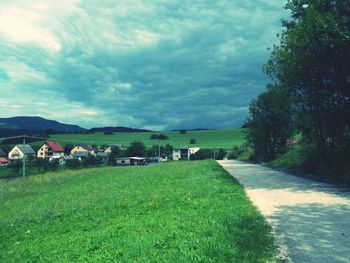 View of road against cloudy sky