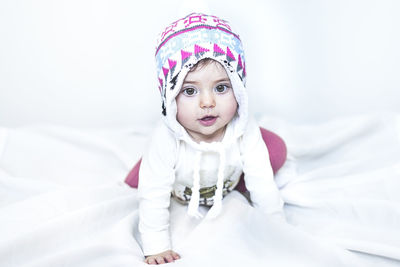 Portrait of cute girl on bed