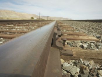 Close-up of railroad track against sky