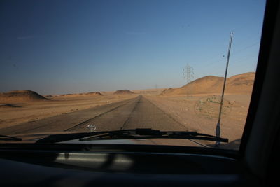 Road seen through car windshield