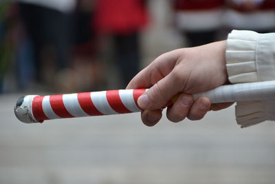 Close-up of hand against blurred background