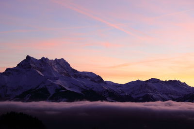 Scenic view of mountains against sky during sunset