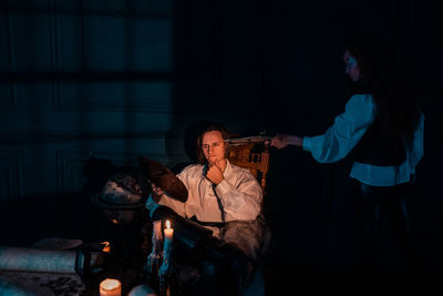 People sitting in the dark room