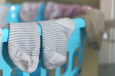 Close-up of multi colored shoes hanging at home