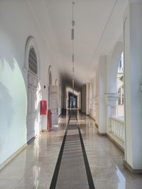 Rear view of man walking in corridor