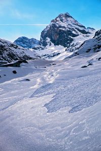 Scenic view of snow mountains against sky