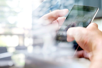 Close-up of hand holding smart phone