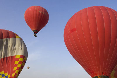 Low angle view of hot air balloons against sky