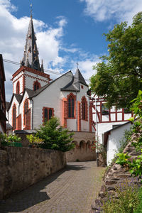 View of temple amidst buildings against sky