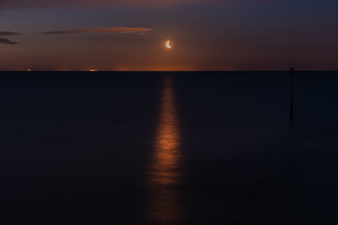 SCENIC VIEW OF SEA AGAINST ORANGE SKY DURING SUNSET