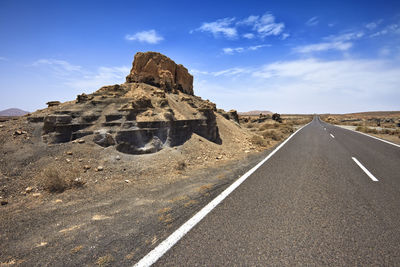 View of road against cloudy sky