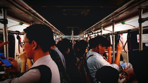 Rear view of people in train