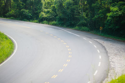 High angle view of empty road by trees